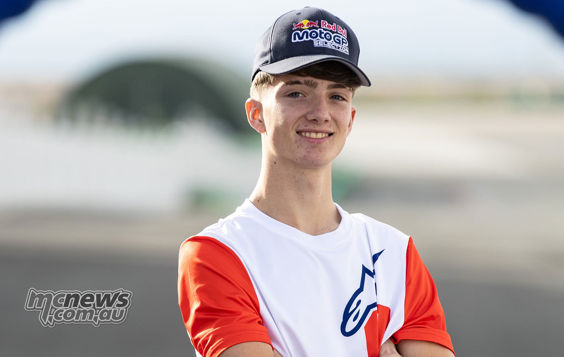 Spanish rider Alex Longarela smiling in a Red Bull MotoGP Selection cap at Guadix