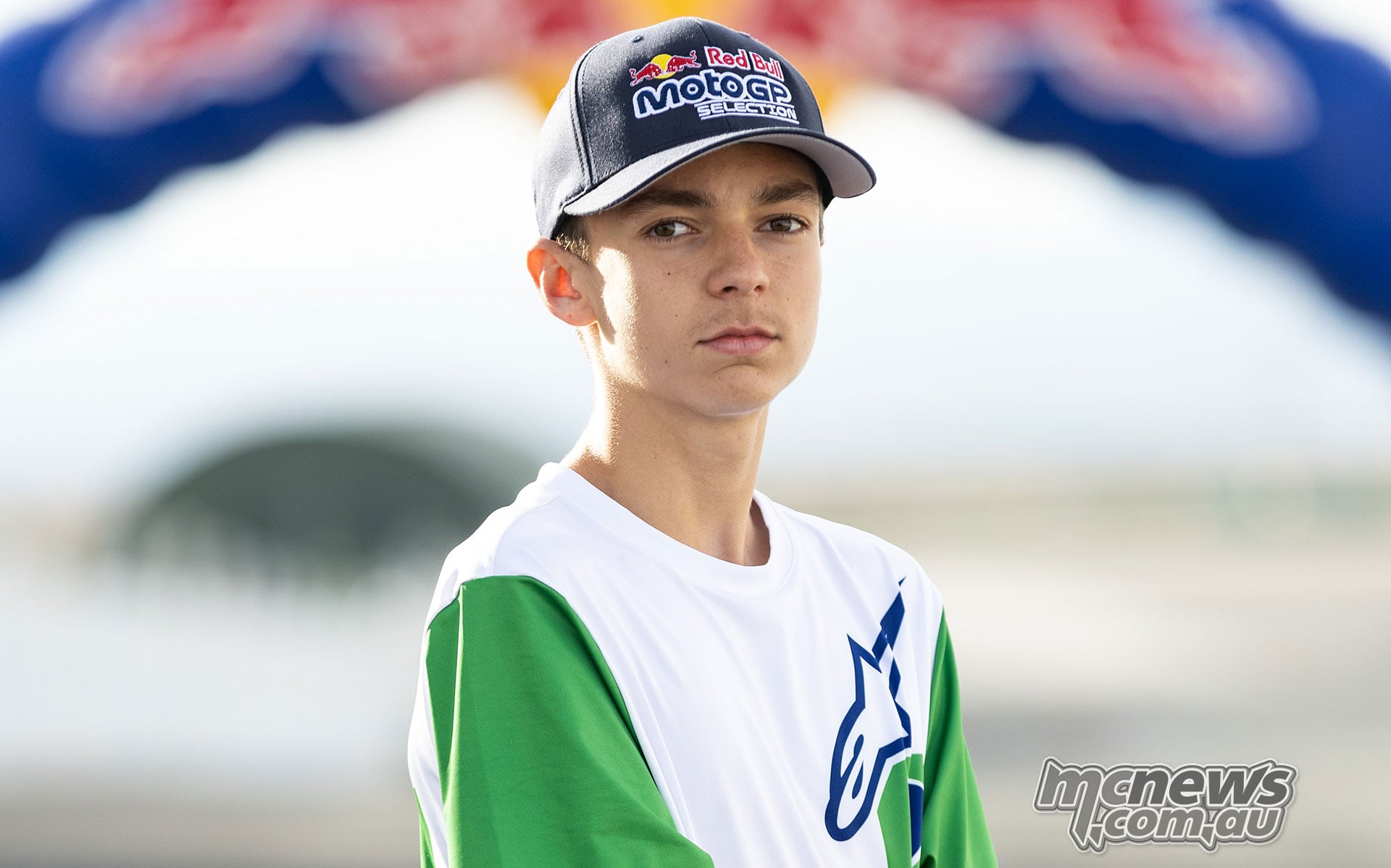 French teenager Johann Dubois wearing a Red Bull MotoGP Selection cap and green-sleeved Alpinestars shirt