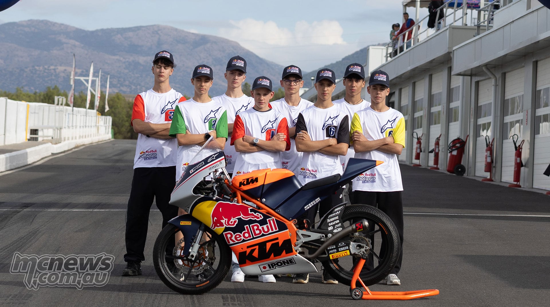 Eight riders selected for the 2027 Red Bull MotoGP Rookies Cup stand behind a KTM race bike at Guadix