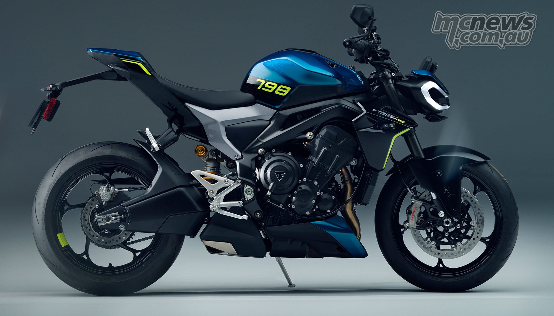2027 Triumph Street Triple 798 RS shown in right-side profile with blue tank and fluorescent yellow 798 graphics