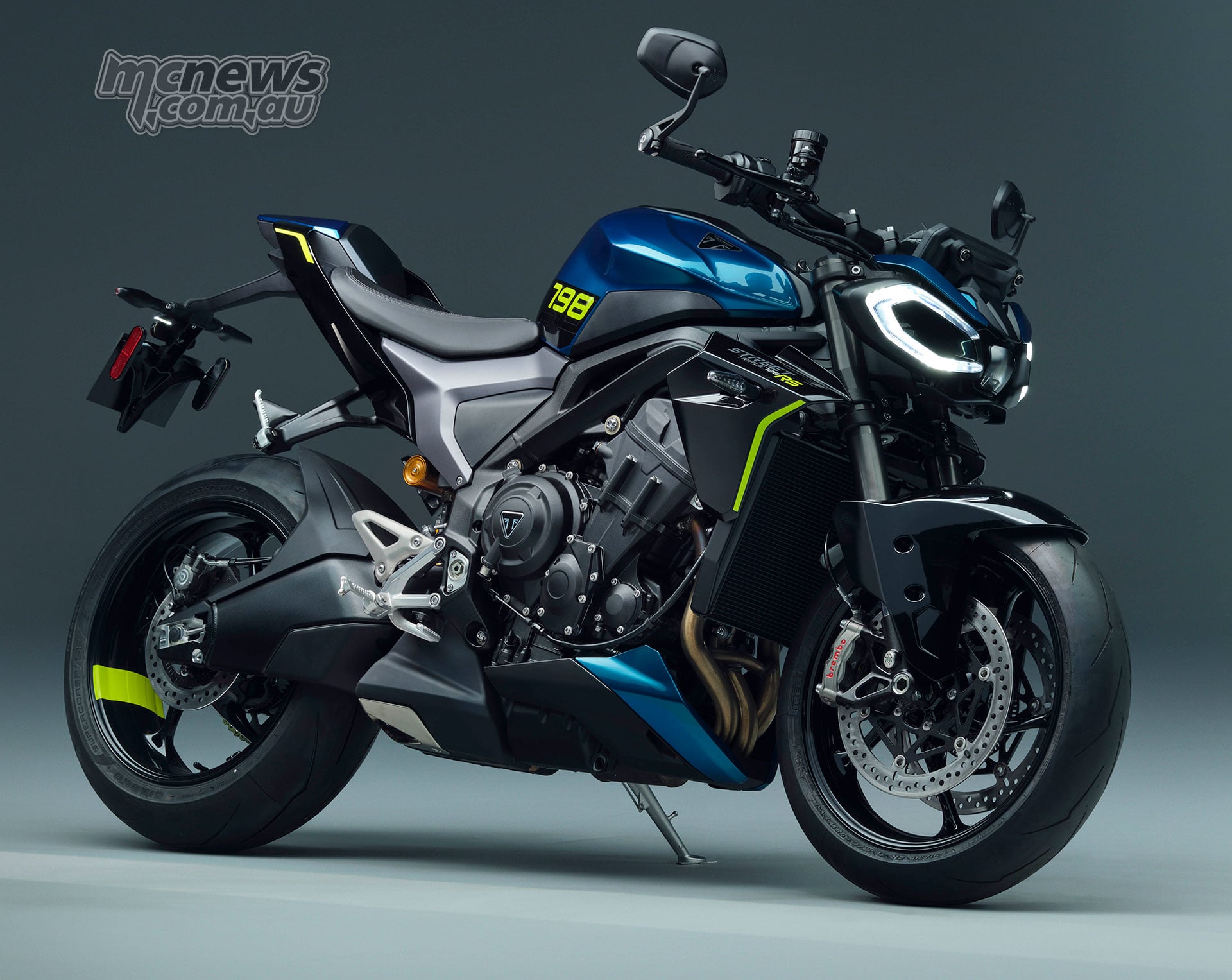 2027 Triumph Street Triple 798 RS close front three-quarter studio view showing blue bodywork and fluorescent yellow accents
