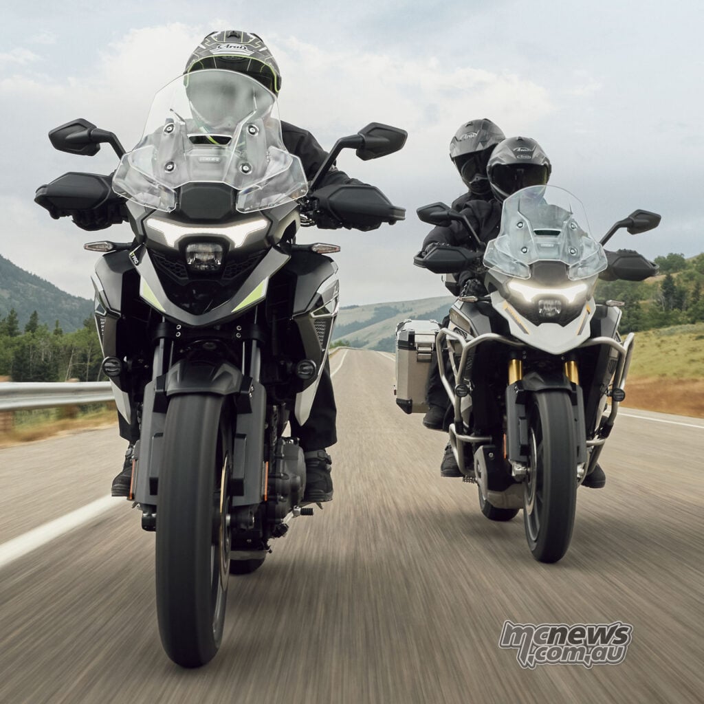 Three Triumph Tiger 1200 motorcycles being ridden towards the camera on a mountain road.