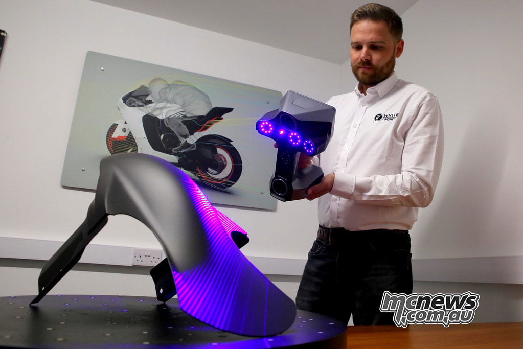 WMC engineer using a handheld 3D scanner on a carbon-fibre front mudguard.