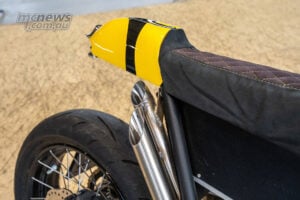 Close-up of twin high-mount exhausts and tail section on Honda CB750 Hornet Sting Honey