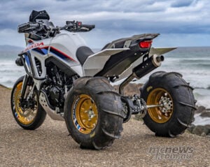 Rear three-quarter view of Honda XL750 Transalp ATC750 custom with twin rear tyres and gold wheels