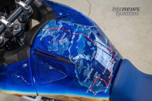 Close-up of Honda XL750 Transalp Dakar Tribute fuel tank showing Paris-Dakar route map artwork