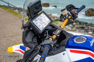 Close-up of Honda XL750 Transalp Saharja custom cockpit with rally navigation display and handlebars