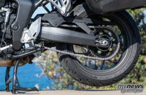 The centrestand takes the usual moment of technique to master, then makes chain inspection and lubrication straightforward on a long trip. Honda CB1000GT rear wheel, chain, sprocket, swingarm and centrestand.