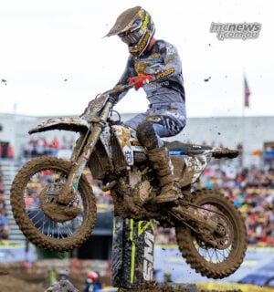 Daxton Bennick jumps his mud-covered number 58 Husqvarna in front of the Columbus grandstands during Race Two.