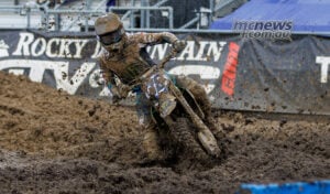 Haiden Deegan leans his number 38 Yamaha through a deeply rutted muddy corner during 450SMX Race One at Columbus.