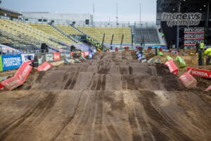 Freshly groomed jumps in the Columbus SMX rhythm section, with machinery tracks visible across the dirt.