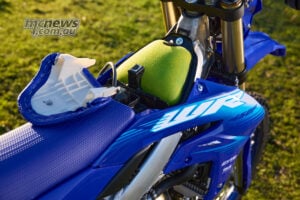 A quick-release cover provides easy access to the high-mounted air filter, which Yamaha positions to maximise the supply of fresh air. 2027 Yamaha WR450F raised air filter with quick-release access cover opened