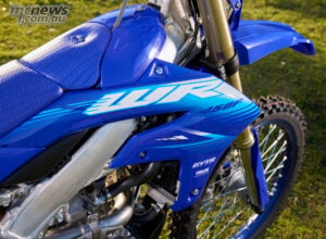 Sleeker side covers, a sharper rear fender and fresh WR450F graphics distinguish the MY27 machine visually. 2027 Yamaha WR450F side bodywork and new WR450F graphics